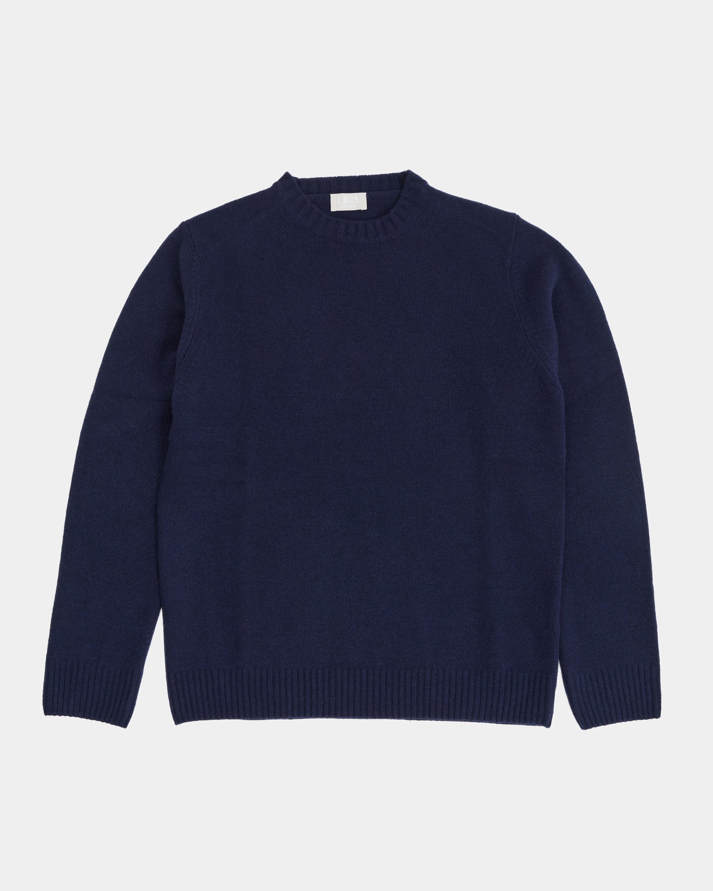 Navy blue sweater on a light gray background