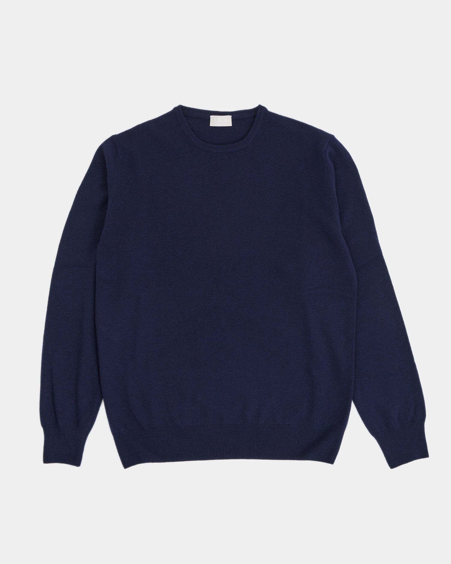 Navy blue sweater on a light gray background